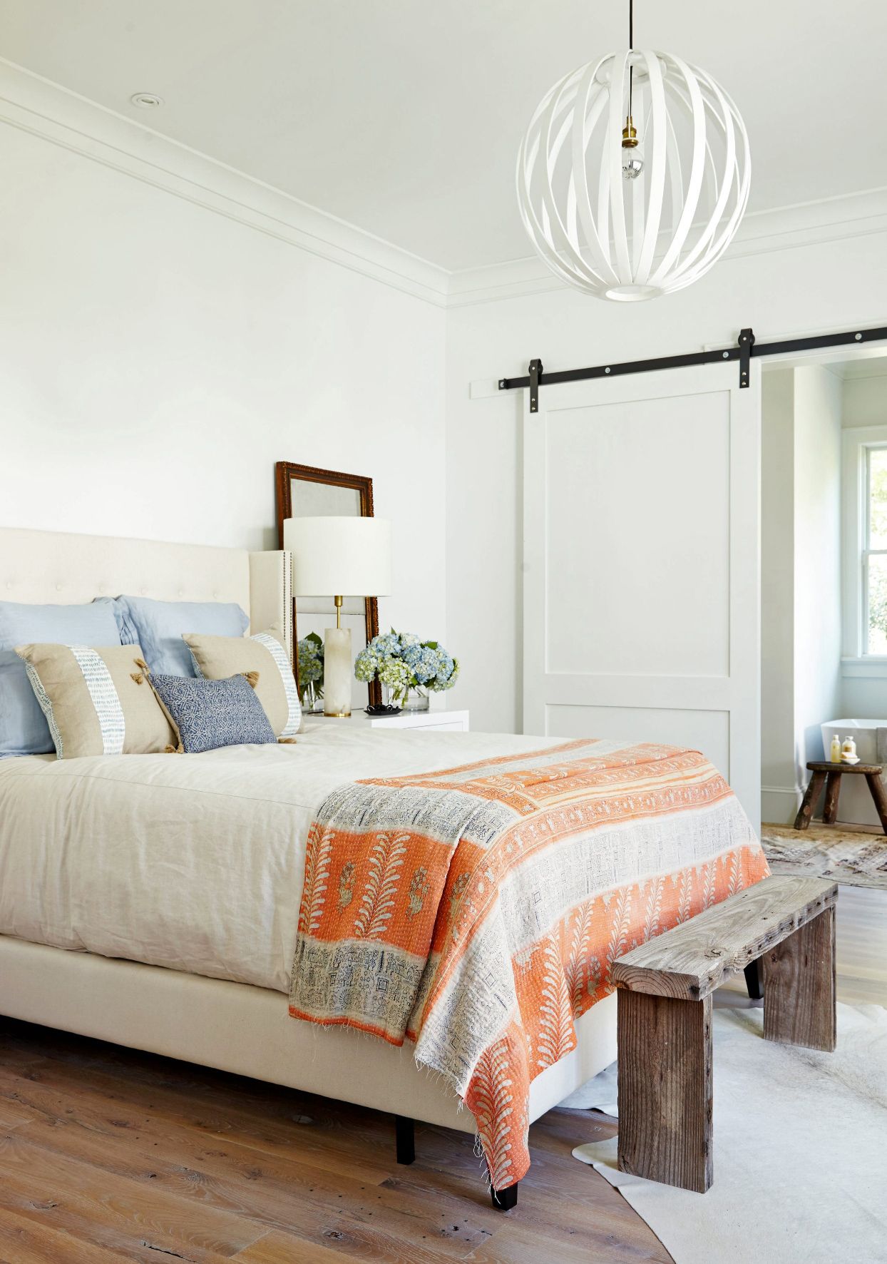 french country bedroom with white bed frame