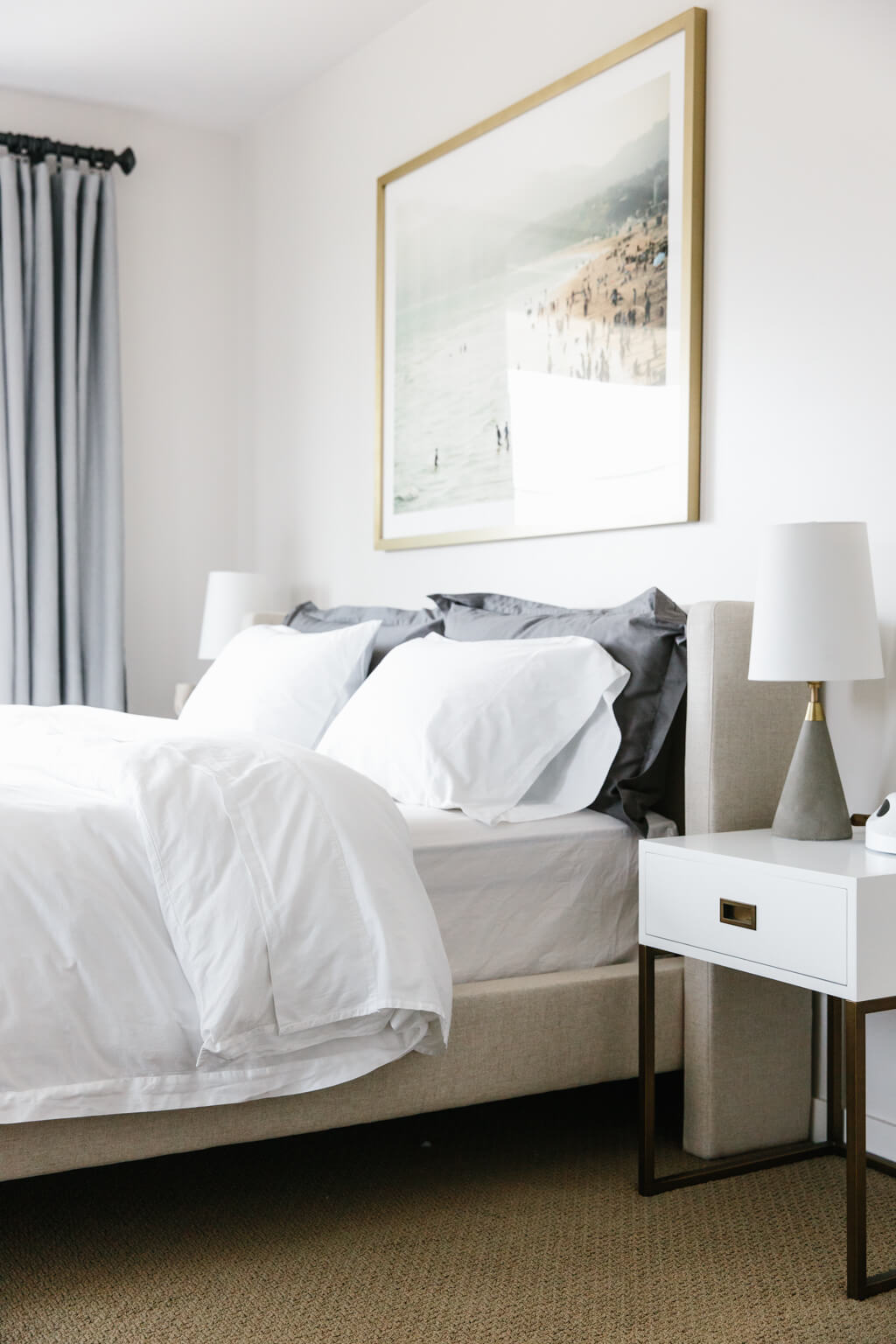 minimalist bedroom with white bed frame