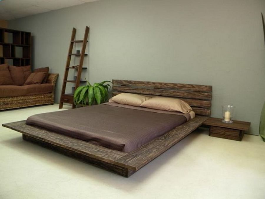 Minimalist floor bed frame in a modern room