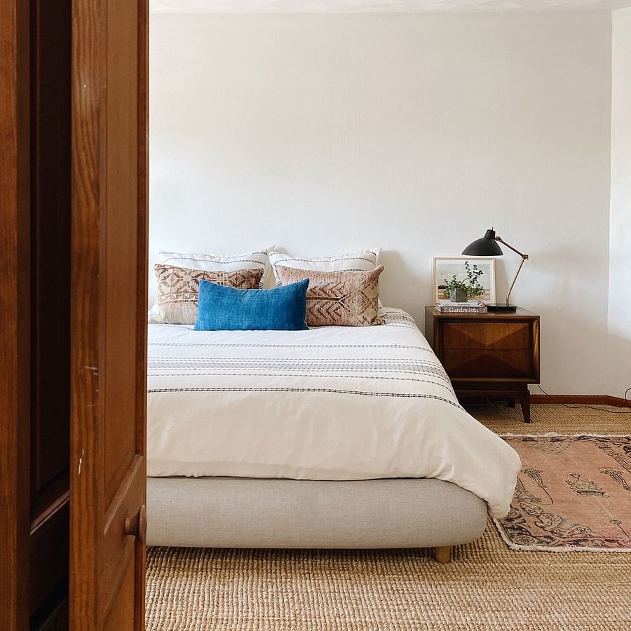 Close up view of a stylish and detailed upholstered bed frame