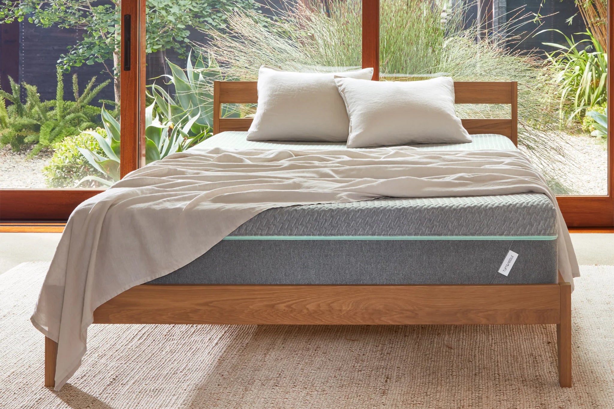 Different types of bed frames: metal, wooden, and upholstered